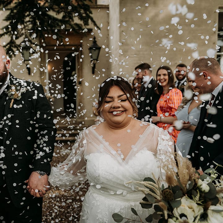 Fun confetti exit for the bride and groom after their intimate wedding ceremony 