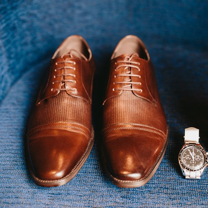 Brown wedding shoes and grooms accessories 