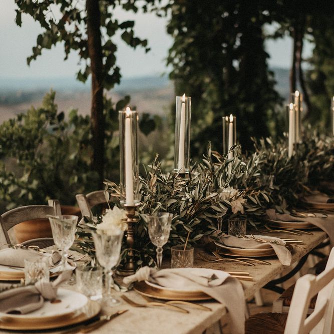 Olive branches line the tablescape in Tuscany