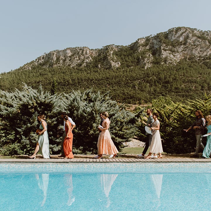 Wedding guests walk to the wedding 