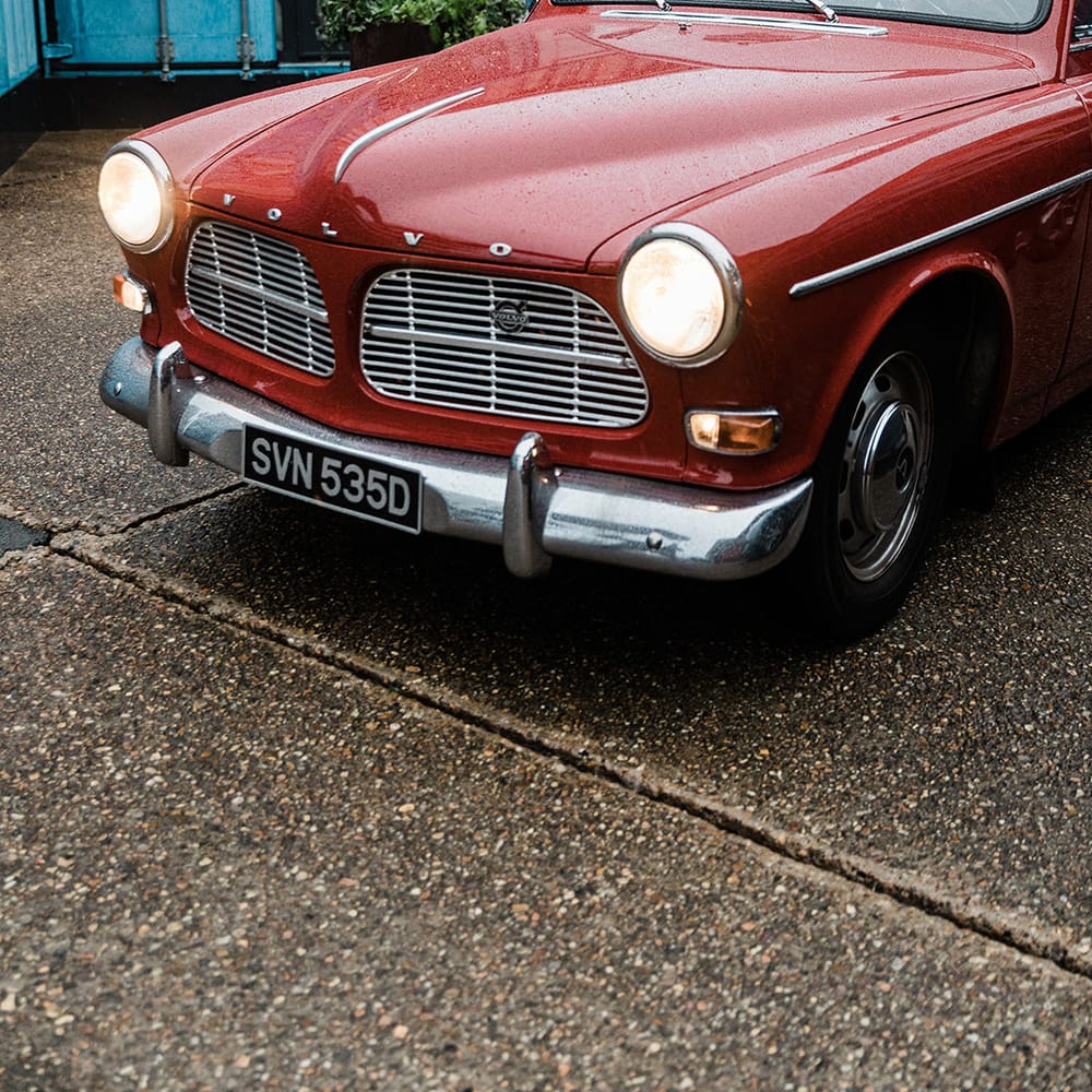 Red vintage Volvo wedding car transportation