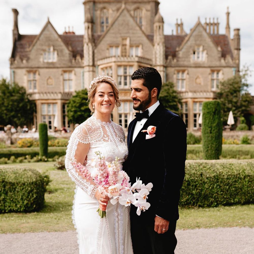 Classic and luxury De Vere Tortworth Court wedding with the bride in a Temperley Bridal wedding dress and groom in velvet suit jacket