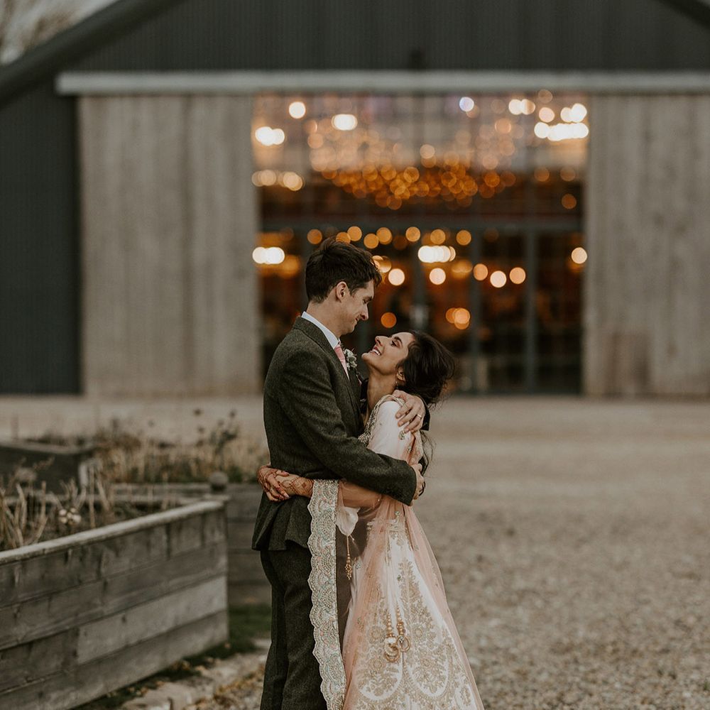 Interfaith wedding with the bride and groom posing for their couple portraits 