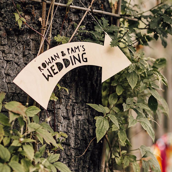 Arrow pointed wedding sign directing guests to the wedding ceremony 