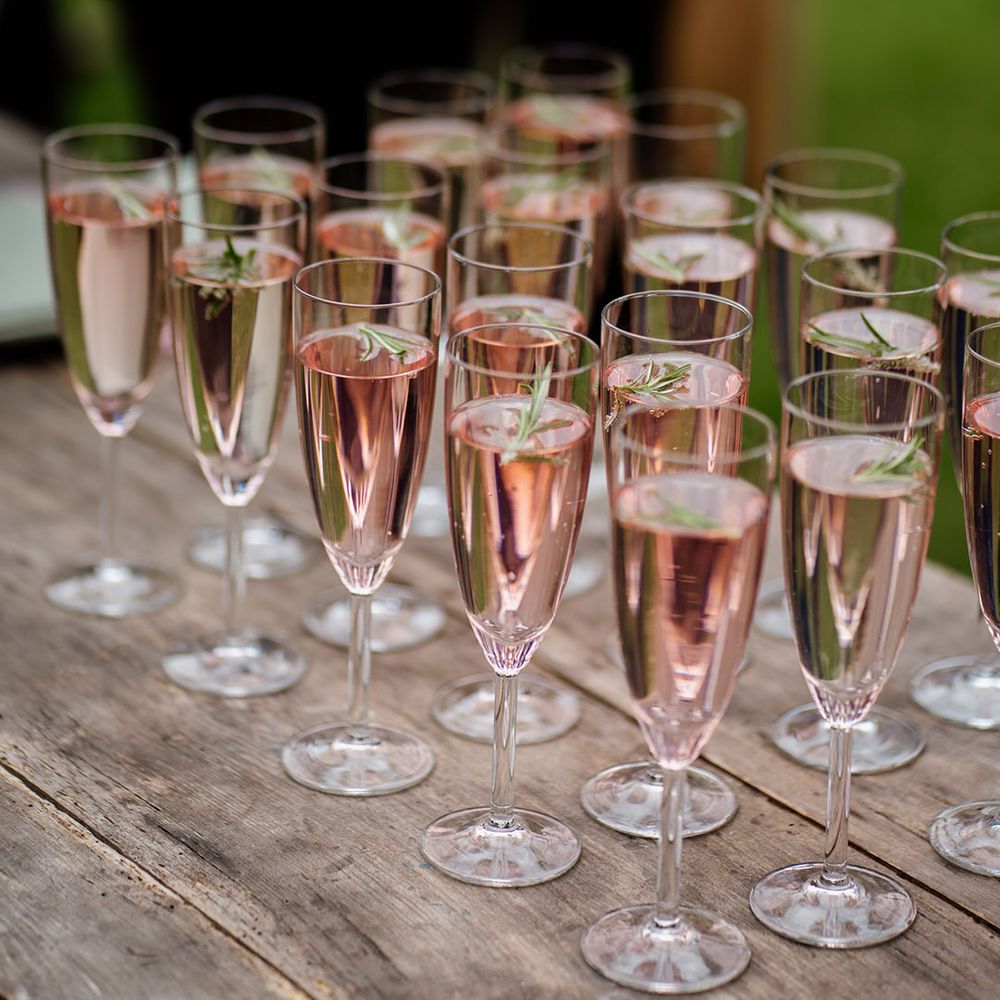Glasses of pink champagne for hen party 