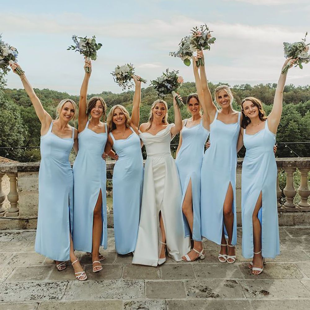 Bridesmaids in blue bridesmaid dresses with front slit at Chateau wedding 