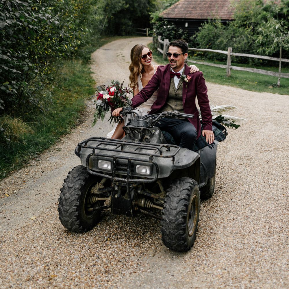 Bride and groom riding a quad bike at High Billinghurst Farm 