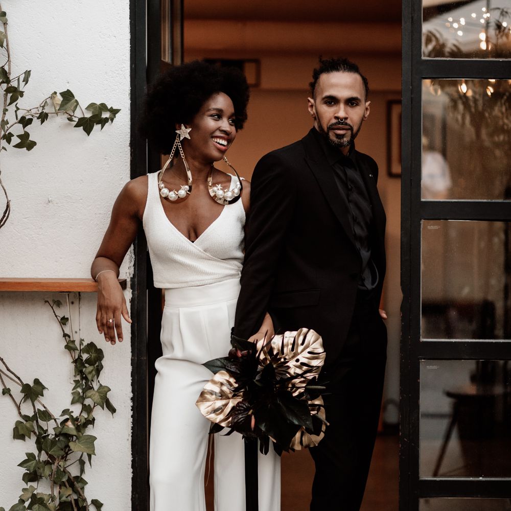 Bride & groom laugh together on wedding day 