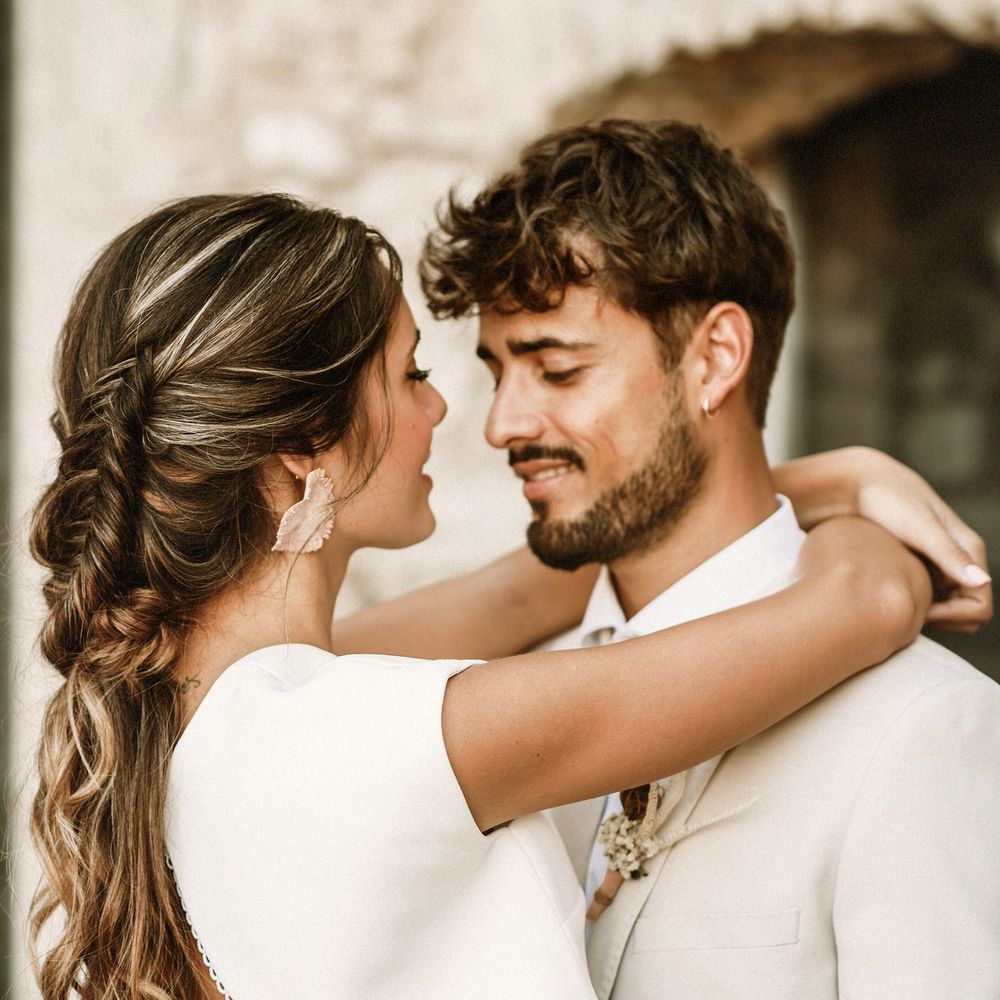 Boho bride with a hal up half down braided updo and open back bridal top 
