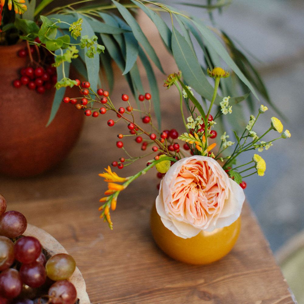 Pink flowers in ceramic and terracotta pots for a Greek destination wedding