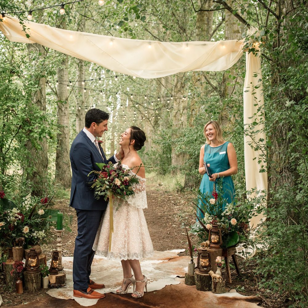 Bride & groom look lovingly at one another during vow renewal 