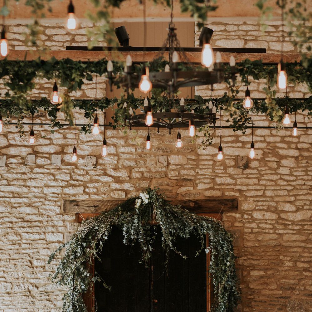 Caswell House wedding venue with foliage decor and festoon lights 