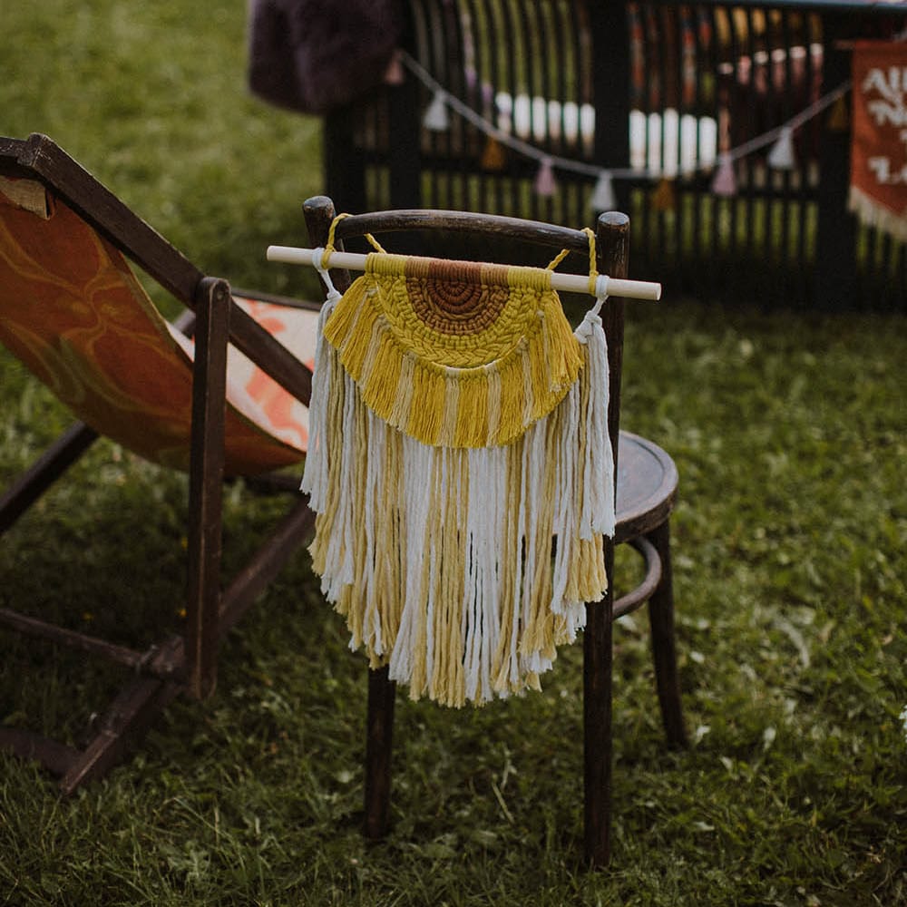yellow macrame chair back decor for outdoor wedding 