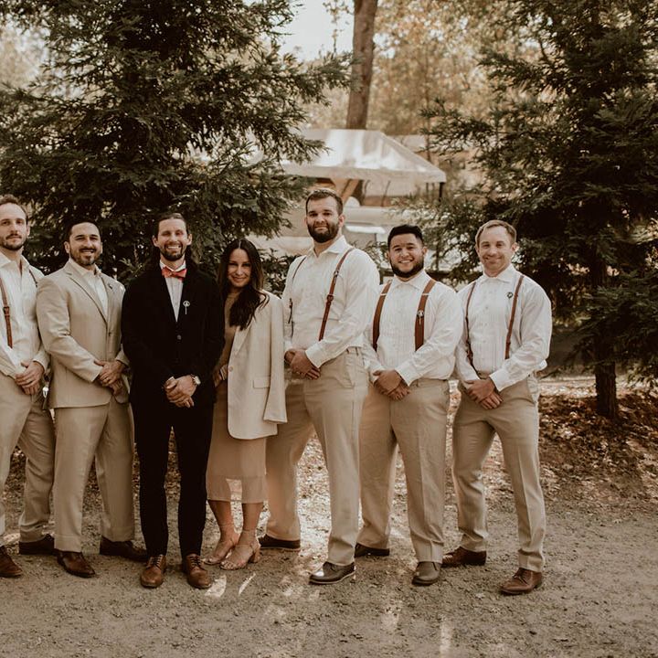 Groom stands with his groomsmen on his wedding day