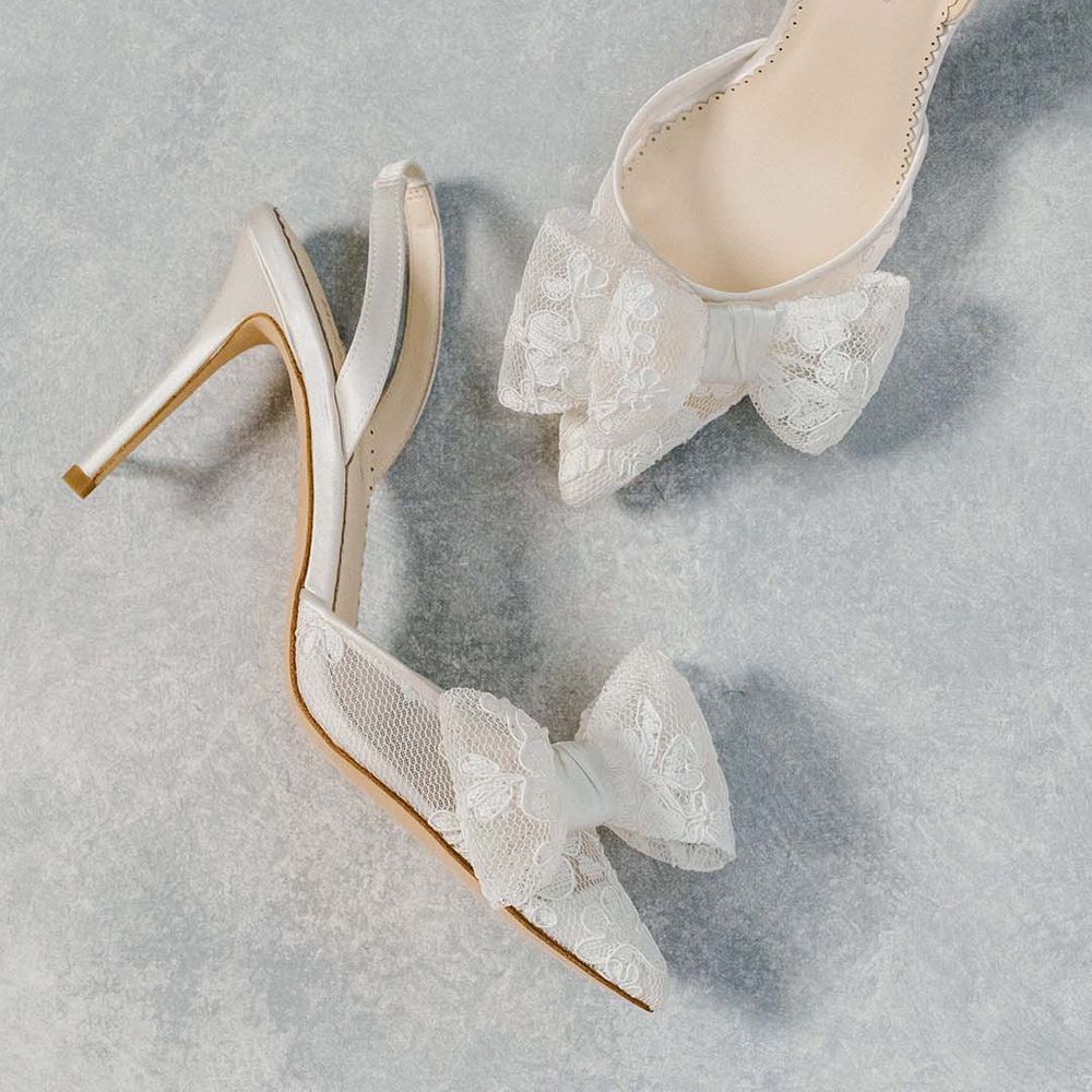 White slingback stiletto wedding shoes with sheer lace bow detail 