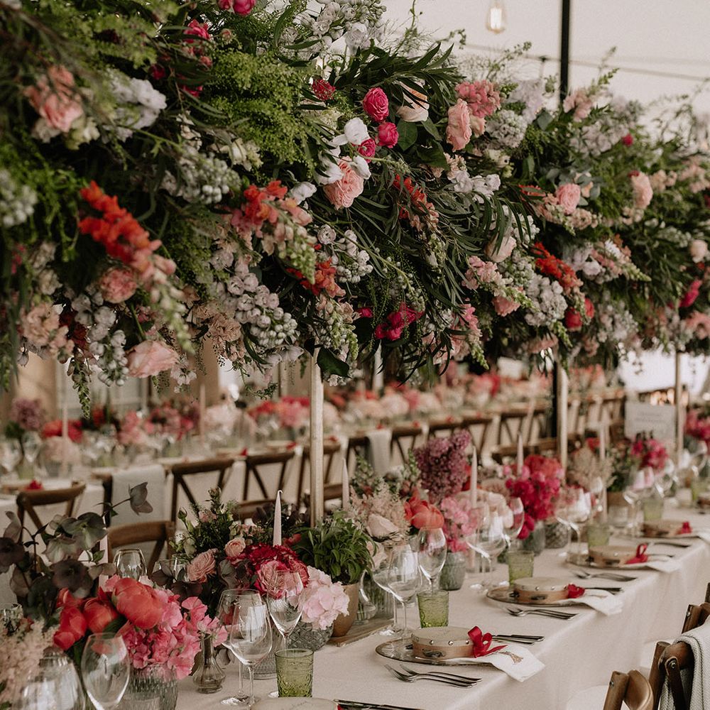 Immense wedding flower display with pink, coral and white flowers for extravagant wedding reception 