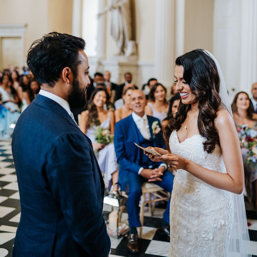 Bride reads personal wedding vows during ceremony at Syon Park