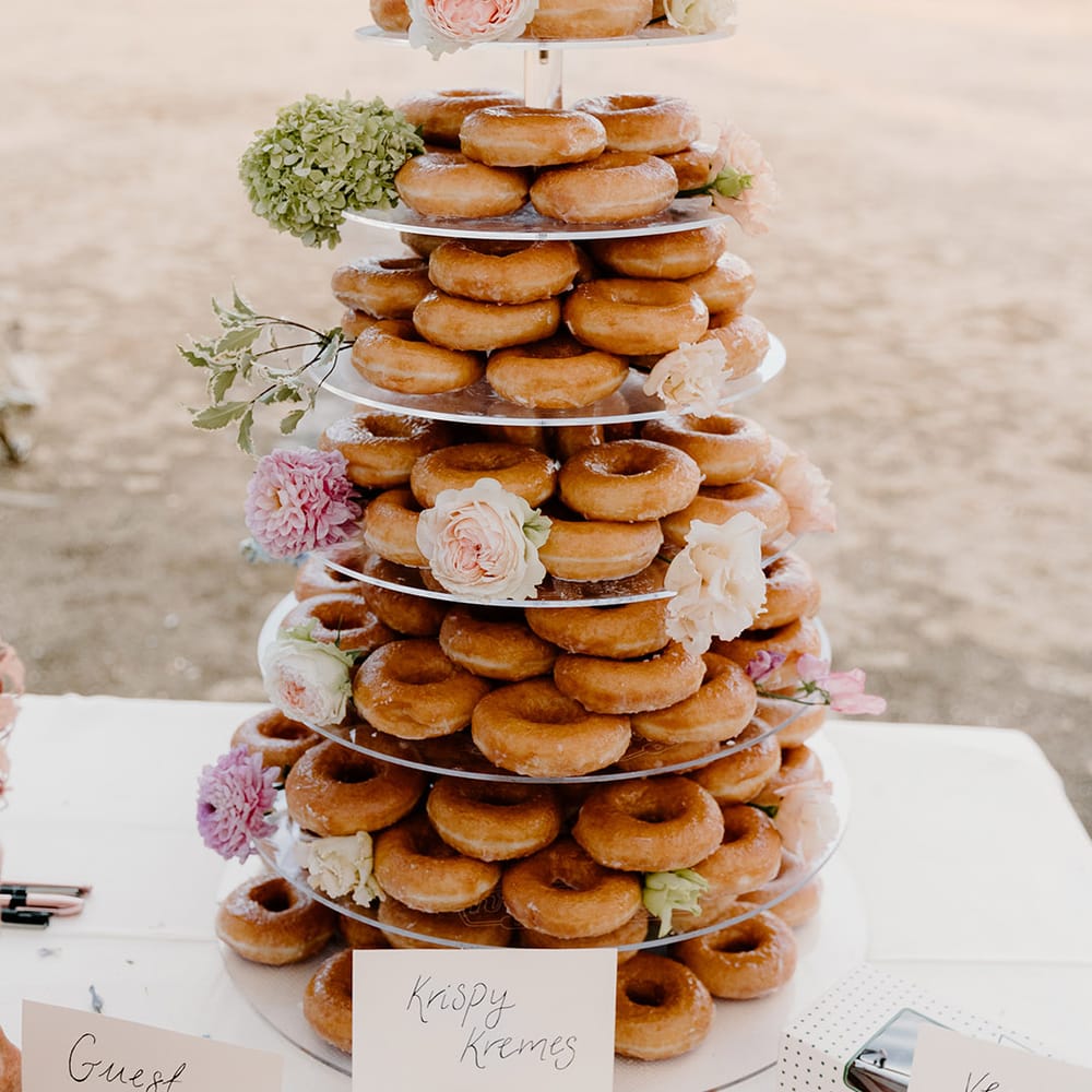 Krispy Kreme doughnut tower complete with floral decor