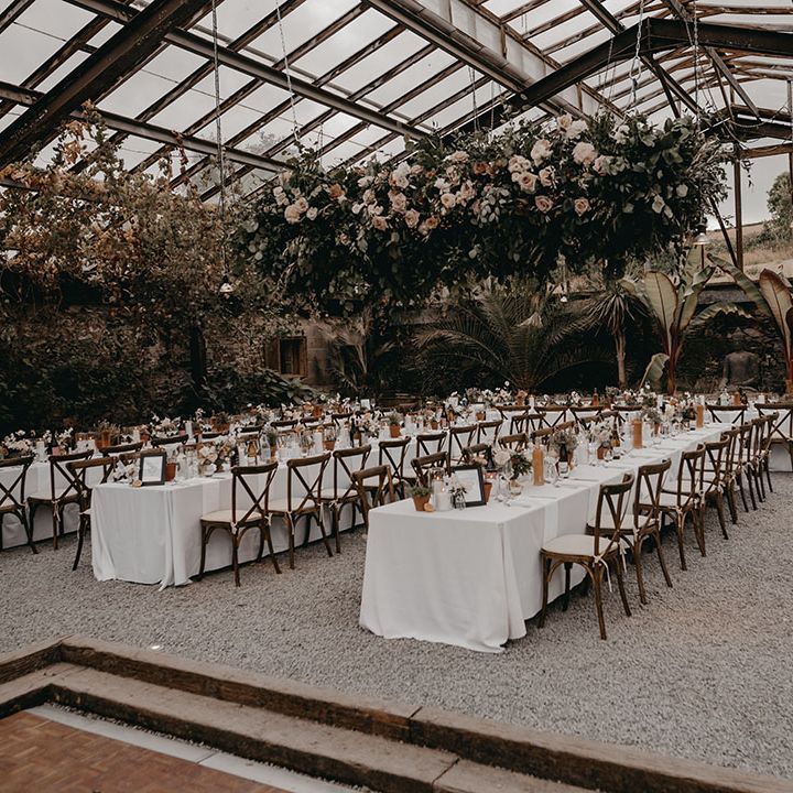 Anran glasshouse wedding venue with a large flower installation to decorate it 