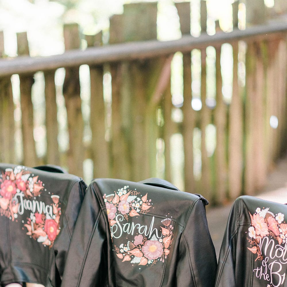 Personalised leather jackets with floral illustrations and names