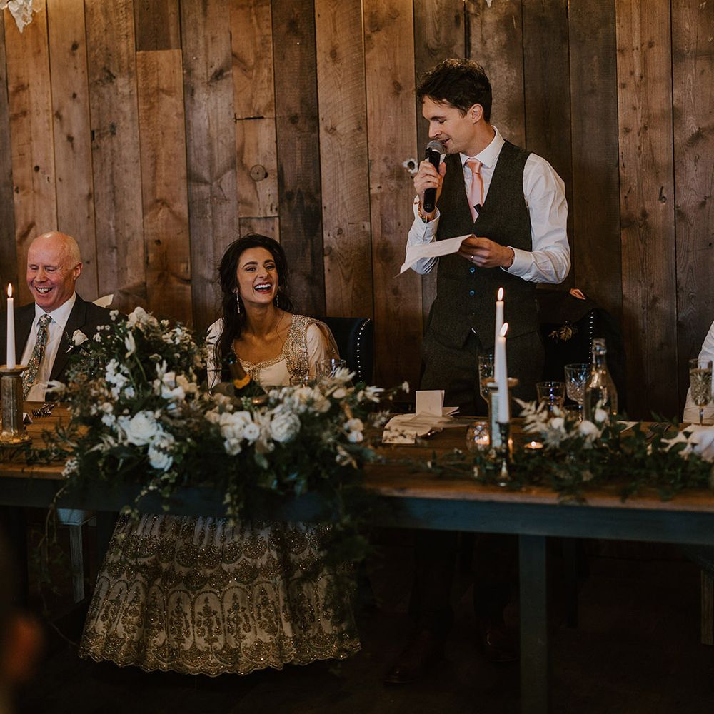 The groom stands up to read out his wedding speech 