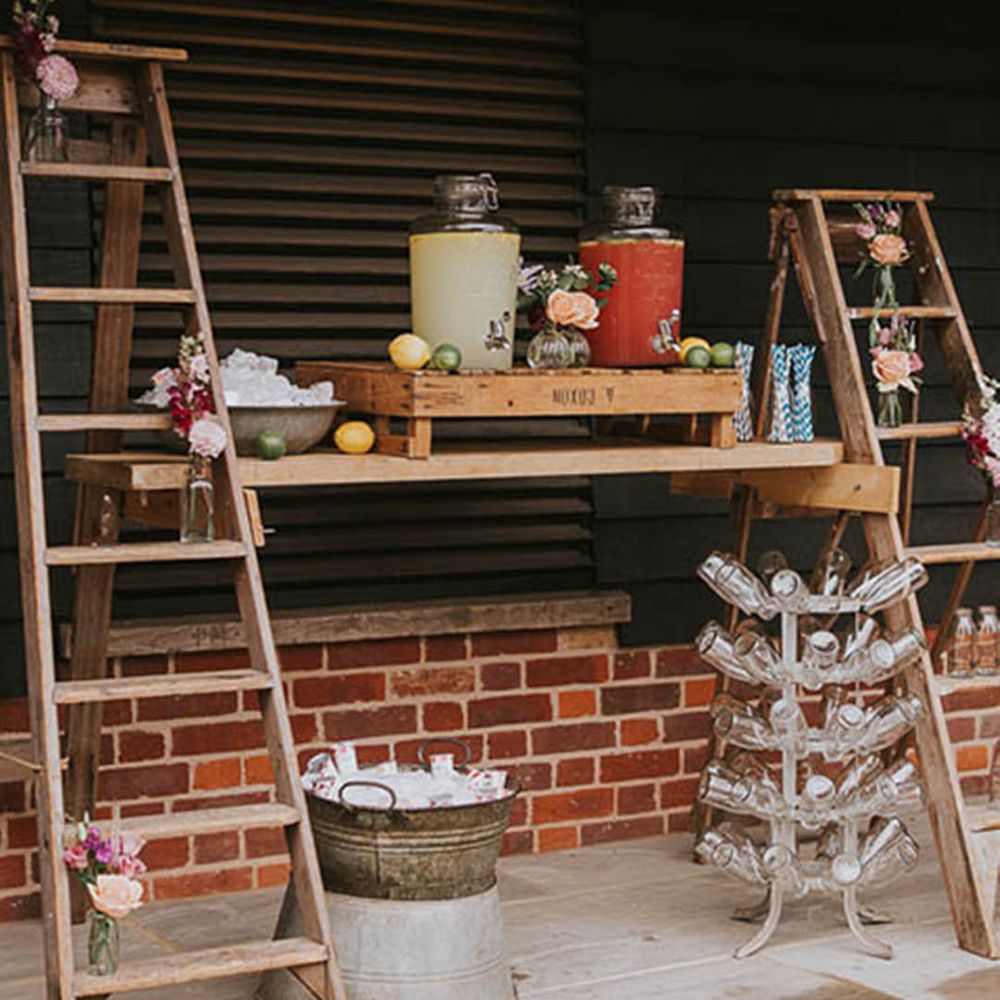 Outdoor wedding hydration station as non-alcoholic wedding bar design idea 