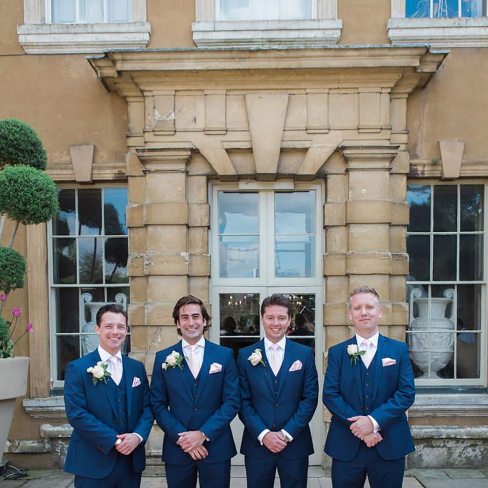 Groomsmen in navy three piece wedding suits for luxe country house wedding 