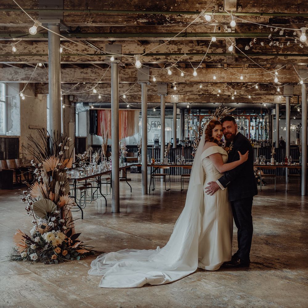 Micro wedding at Industrial wedding venue, Holmes Mill, with festoon lights and dried flowers 