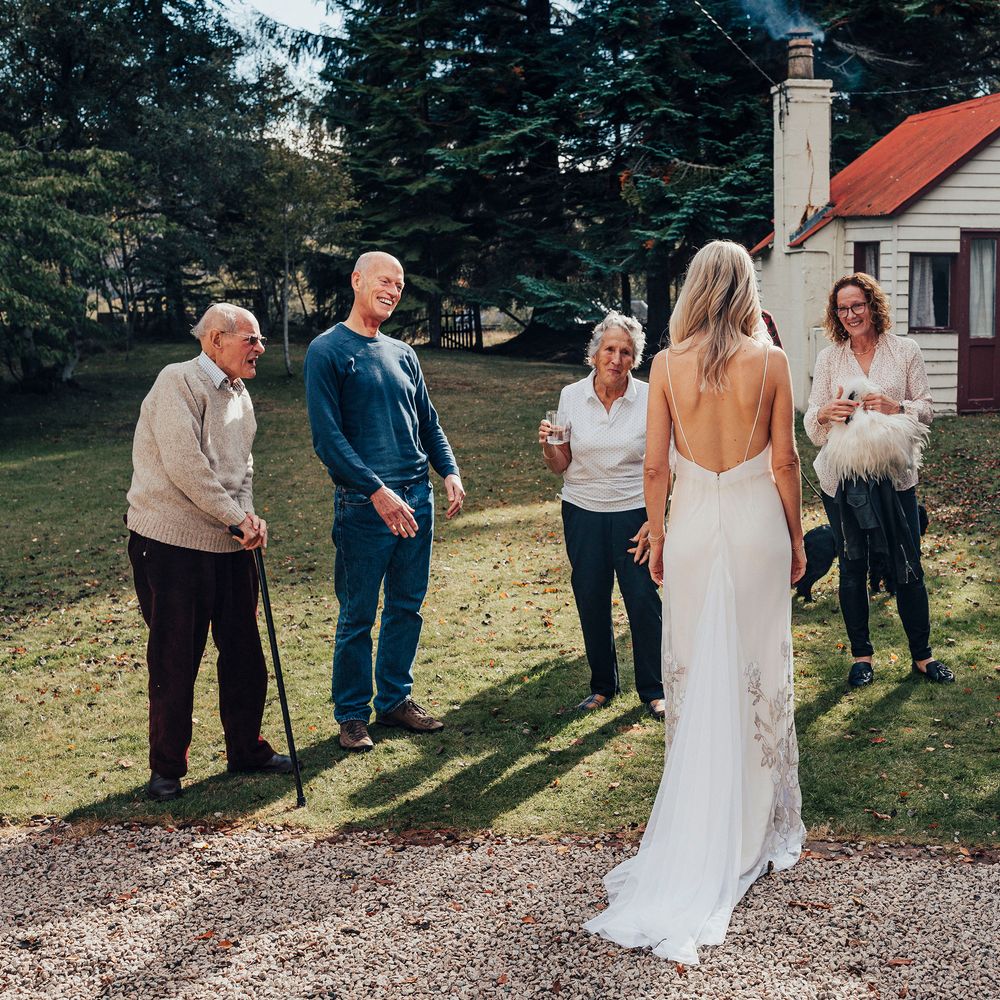 Bride reveals herself to wedding guests for the first time