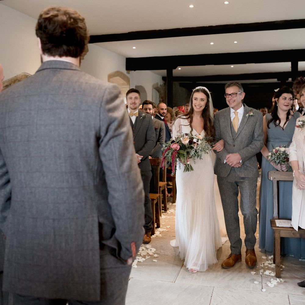 Father of the bride walking his daughter down the aisle 