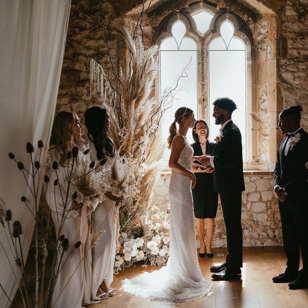 Intimate humanist wedding ceremony at Pentney Abbey with dried and fresh flower arrangements 