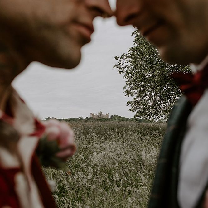 Close up of grooms outdoors on their wedding day