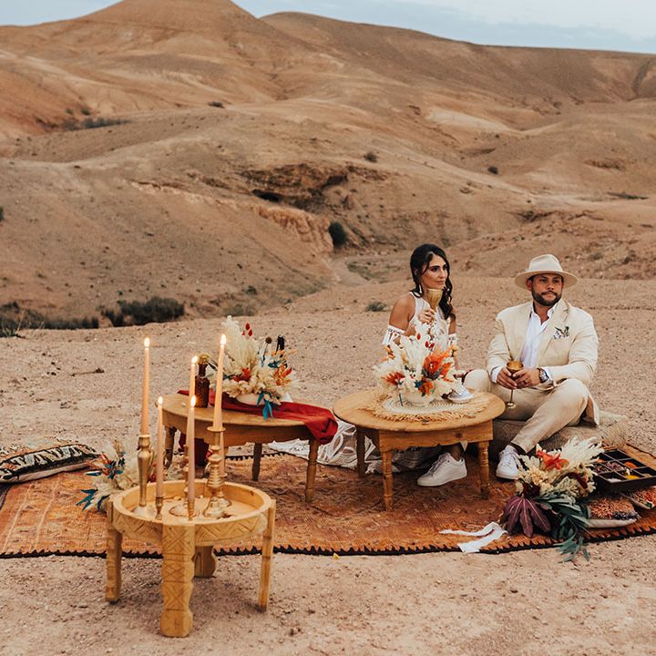 Persian rug, dried wedding flowers and table for intimate wedding breakfast for the bride and groom 