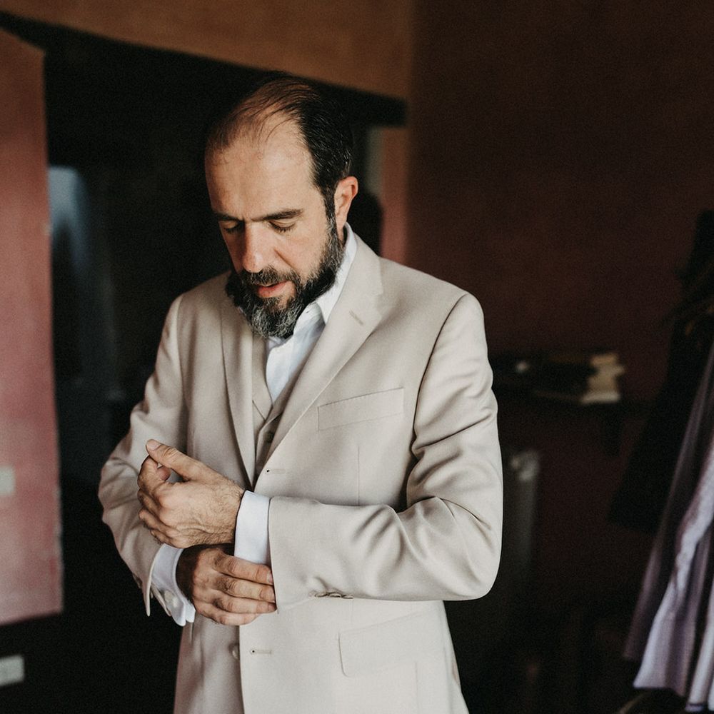 Tuscany groom getting ready in his Suter & Co suit