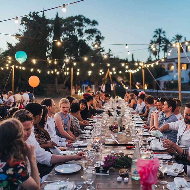 Wedding guests outdoors for wedding reception in Menorca