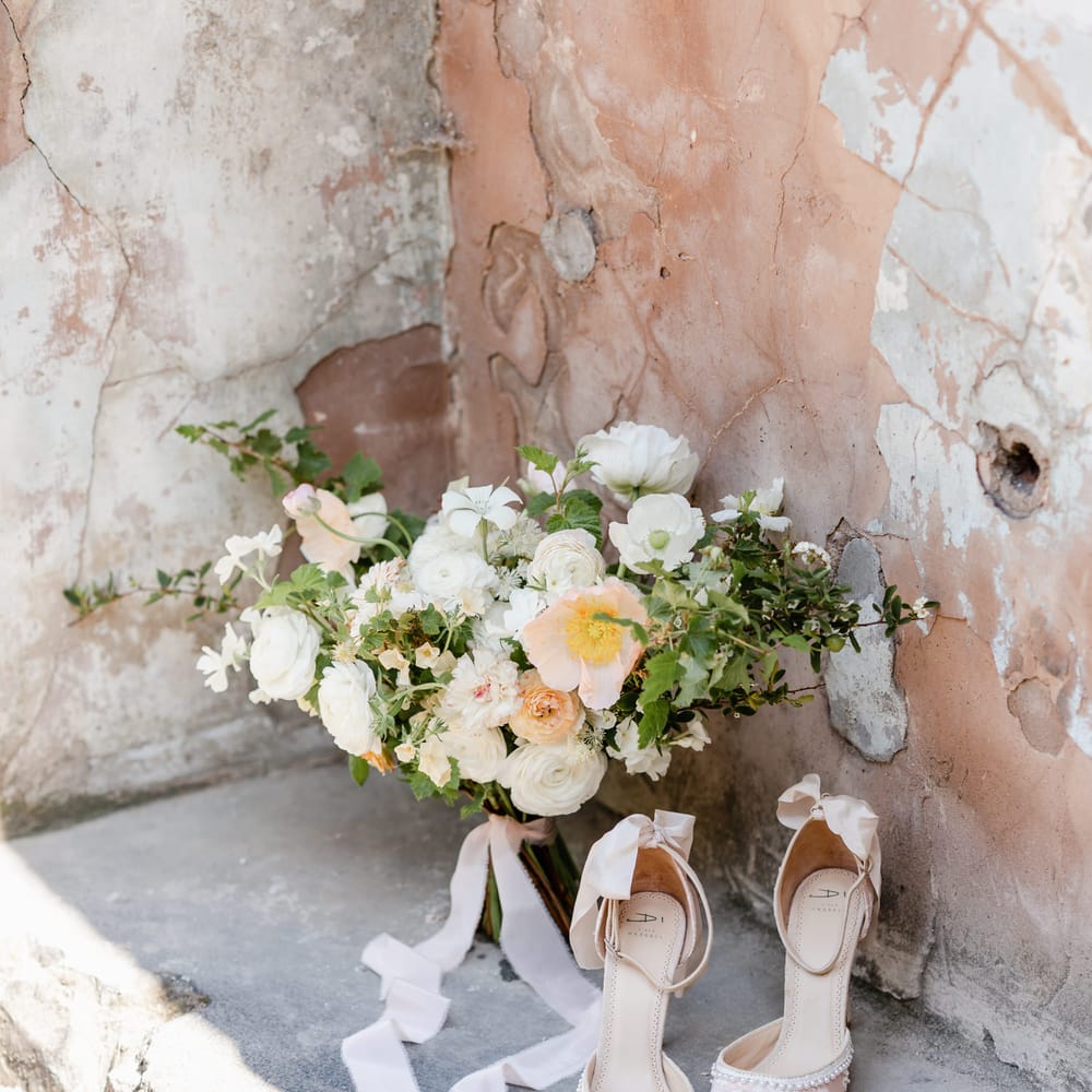 White and yellow wedding bouquet and embellished shoes with ankle strap and ribbon detail 