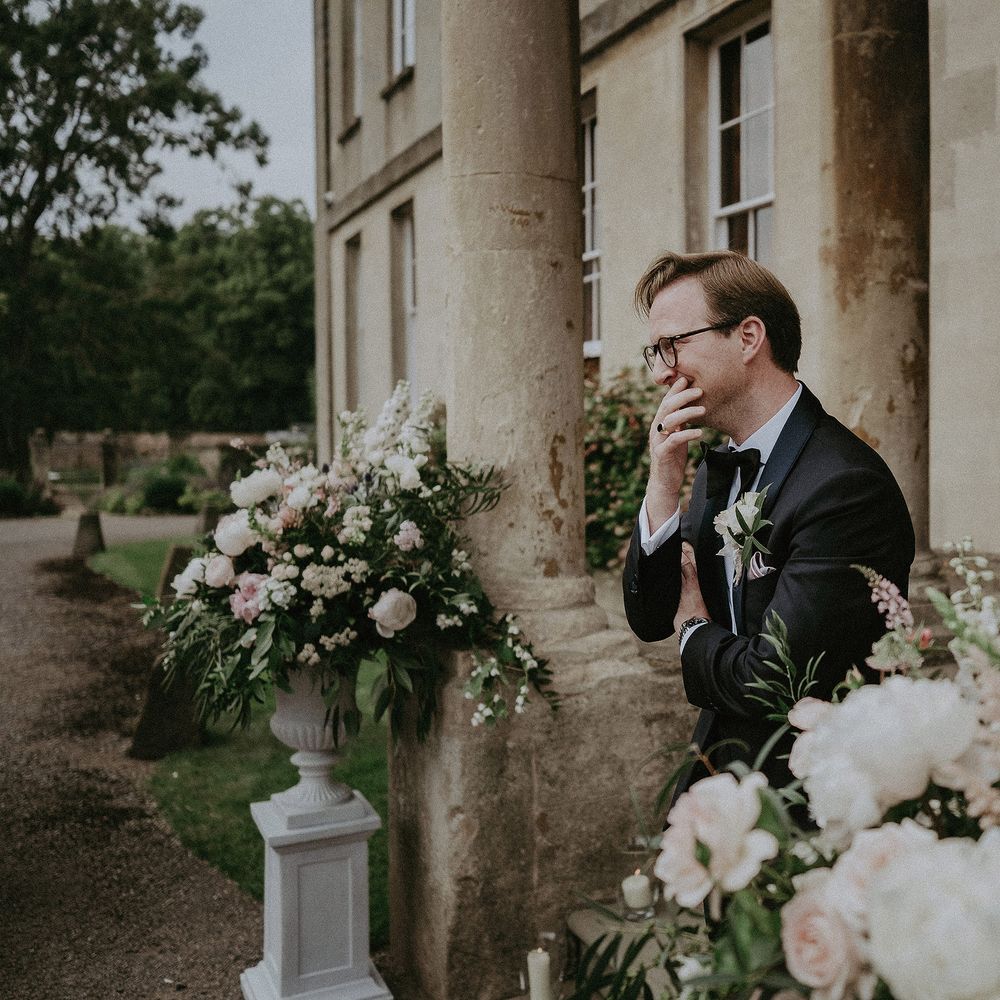 Groom sees bride for the first time on the day of his wedding at Elmore Court