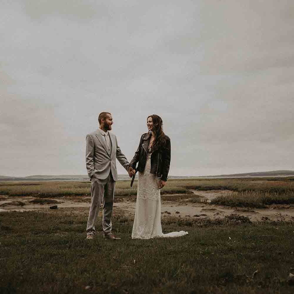 Bride covers up with oversized leather jacket 
