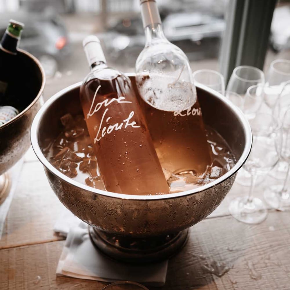 A bucket of chilled cold pale rose for wedding guests to celebrate 
