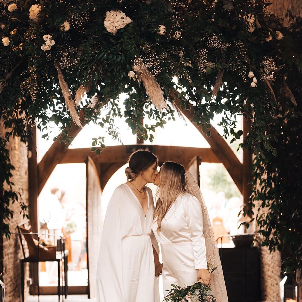 Lesbian wedding at Cripps Barn with two brides in jumpsuits