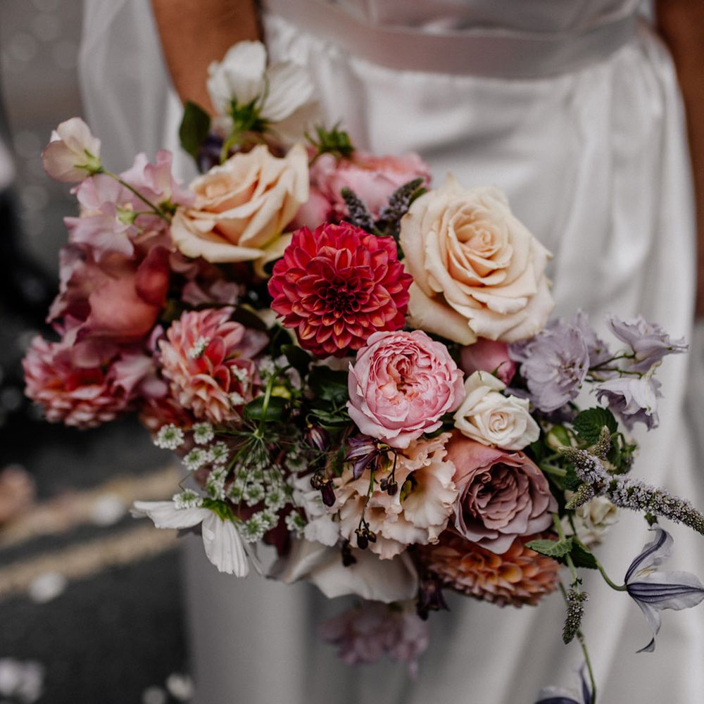 Pink, lilac and lemon pastel wedding bouquet with roses and dahlias 