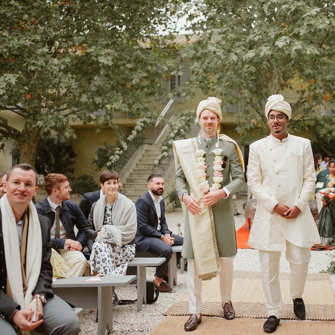 Groom and bestman in cream and green Sherwani and Churidar outfits