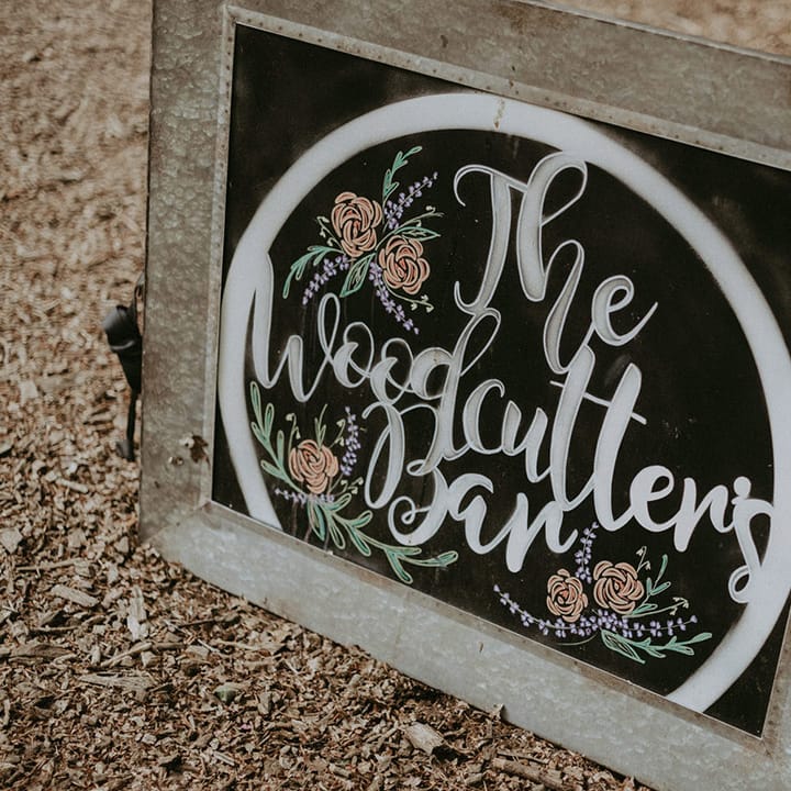 Chalkboard wedding signage directing guests to the bar 