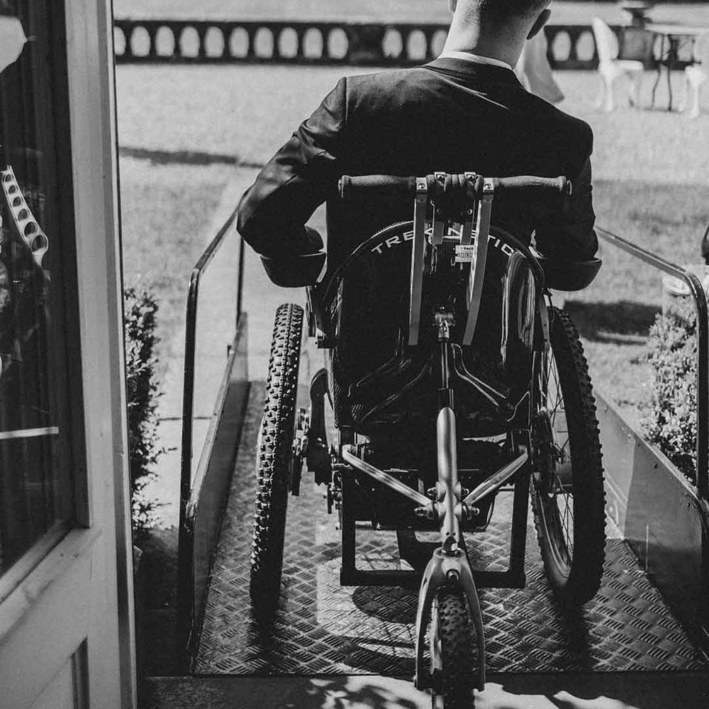 disabled groom in a wheelchair using a ramp at accessible wedding venue in Cheshire 