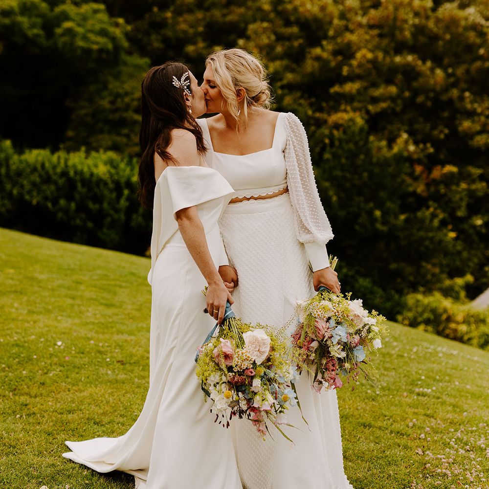 Dorset wedding with two brides at a classic wedding with pastel wildflower bouquets at Pennsylvania Castle Estate 