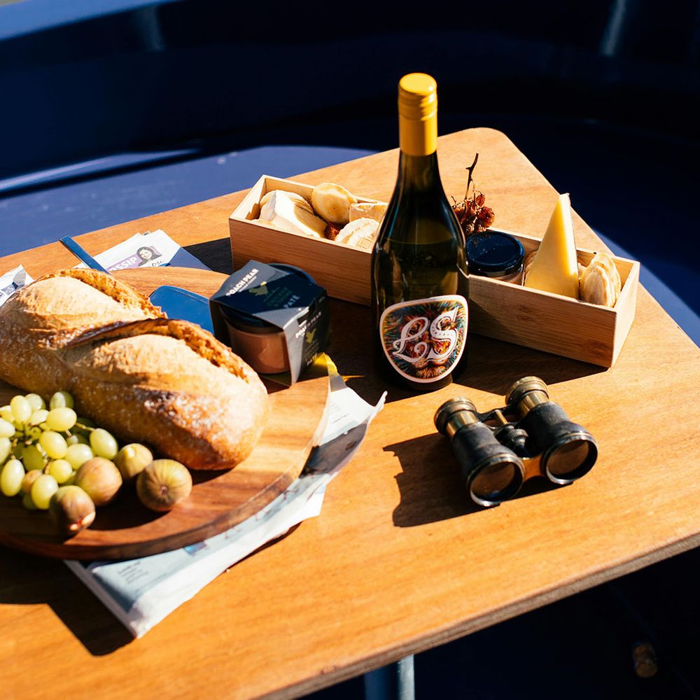 Stock image of charcuterie board, prosecco and snacks on a boat