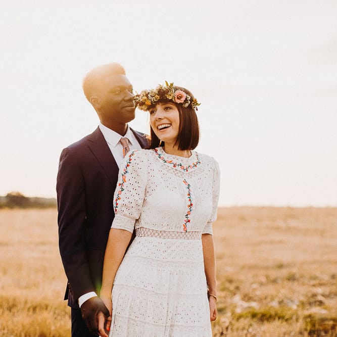 Bride and groom golden hour portraits in a field by Voyteck | London Wedding Photographer 