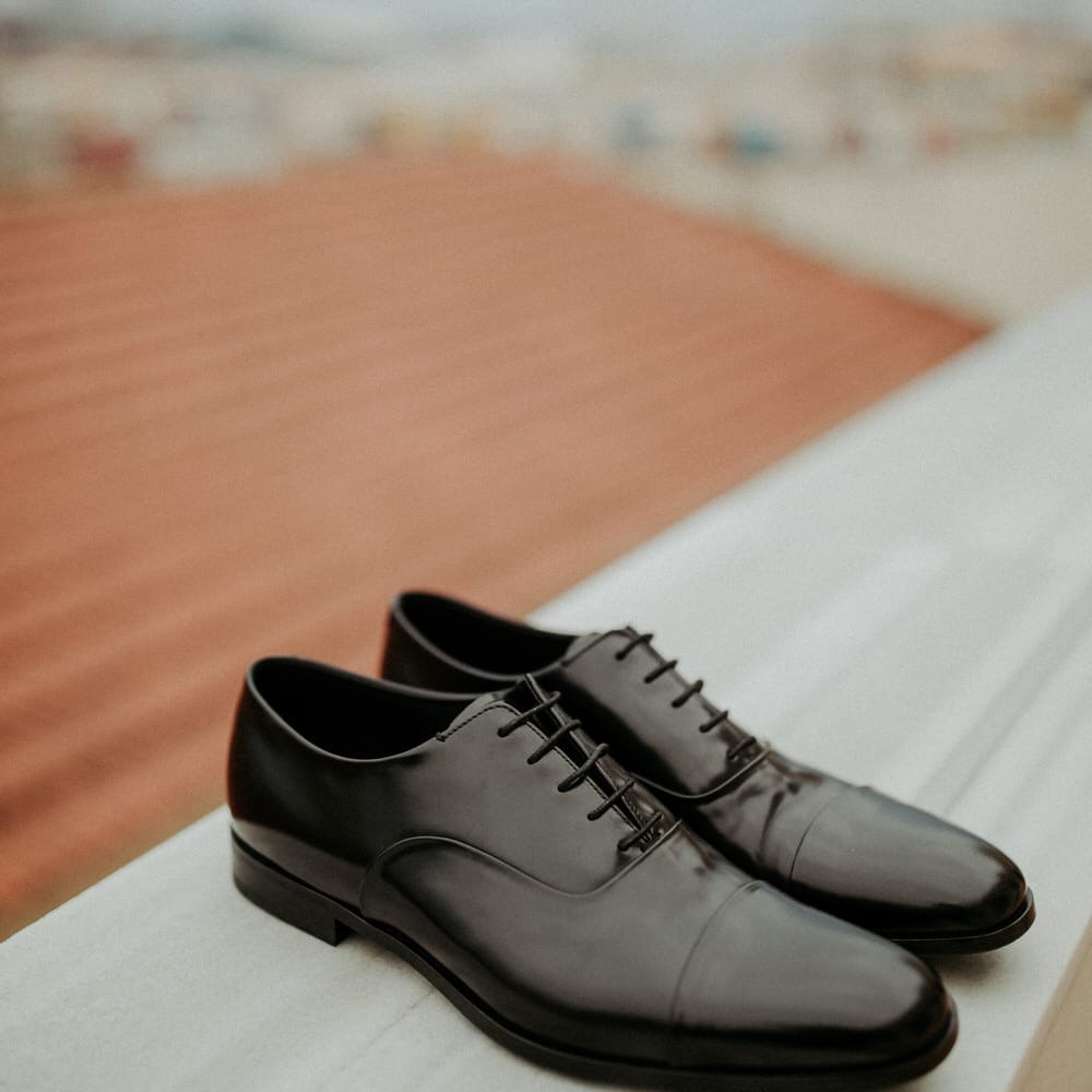 Black Prada wedding shoes for the groom