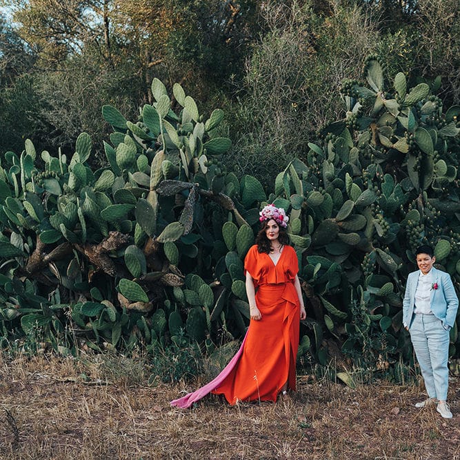 Brides stand apart in the countryside for their post wedding photoshoot
