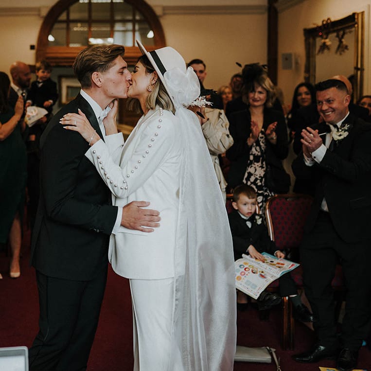 Bride and groom share their first kiss as a married couple 